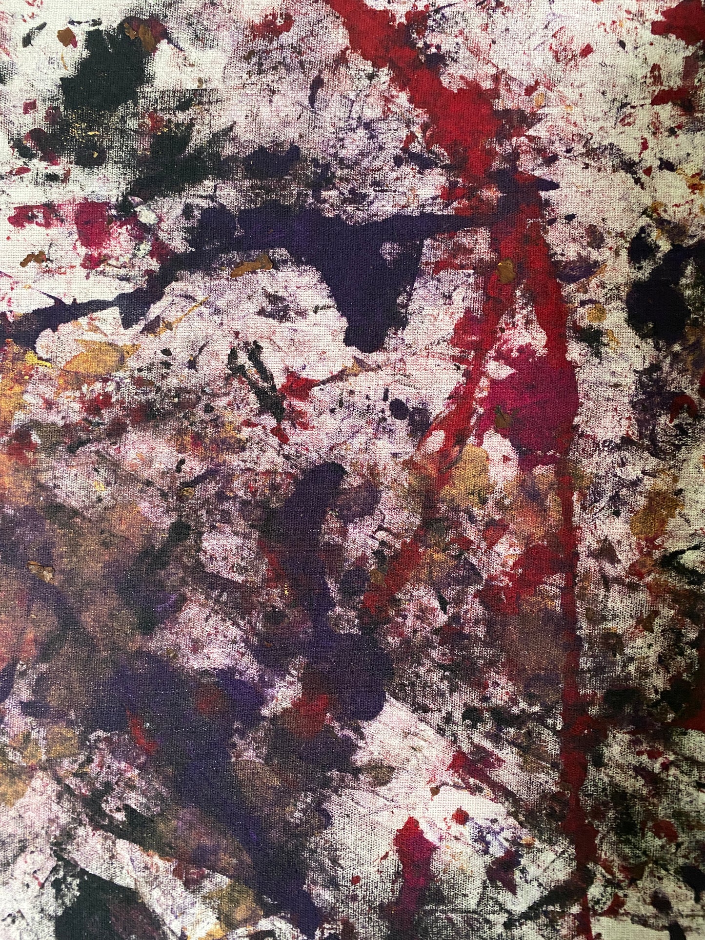 Abstract art with splashes of red, black, gold and white on a stretched canvas frame.  36" x 48" 