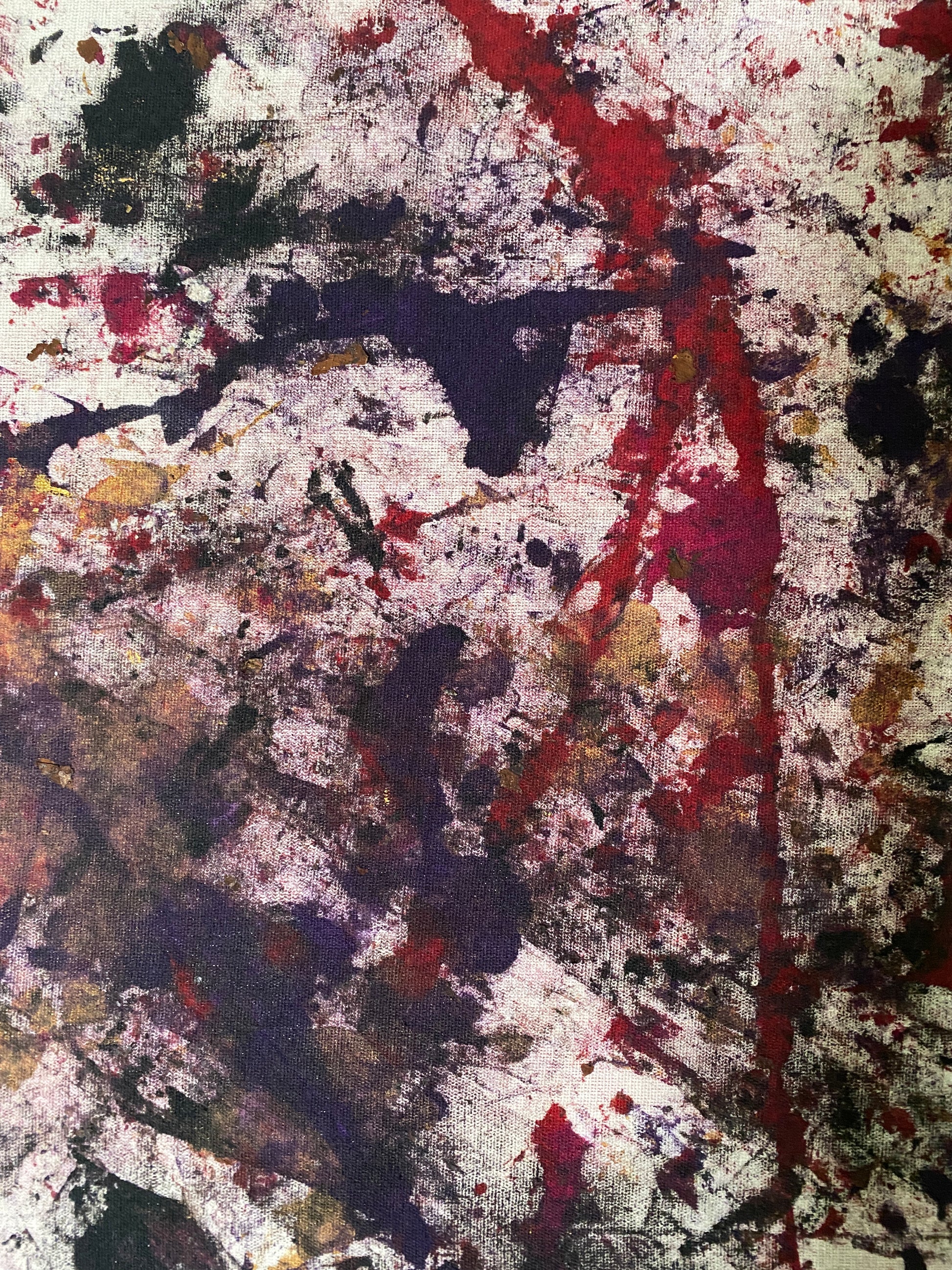 Abstract art with splashes of red, black, gold and white on a stretched canvas frame.  36" x 48" 